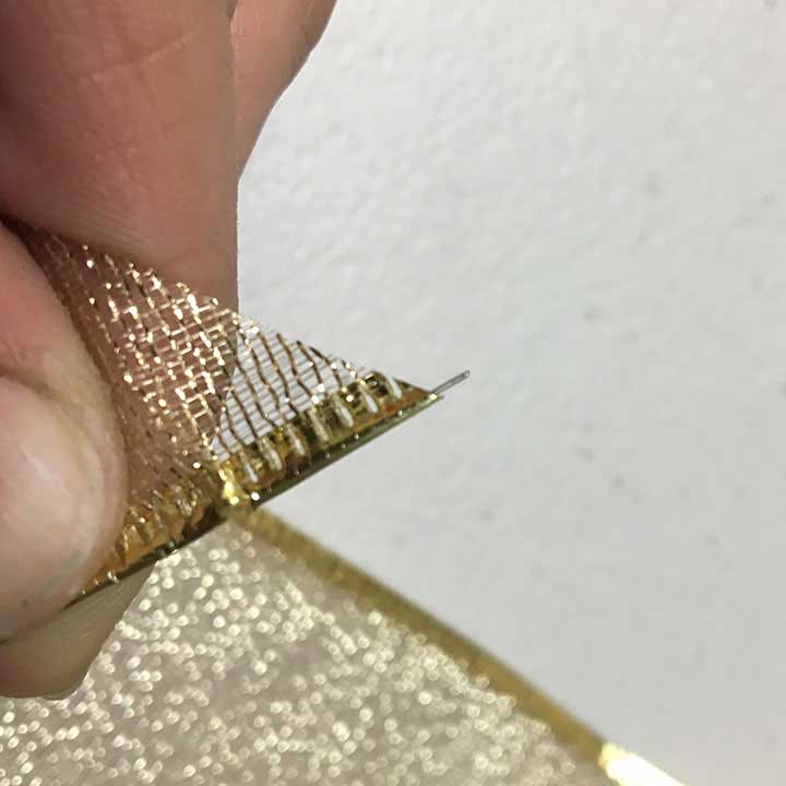 Cutting wire off end of bow tail