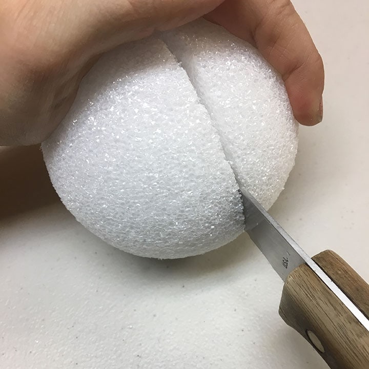 Cutting styrofoam ball with knife