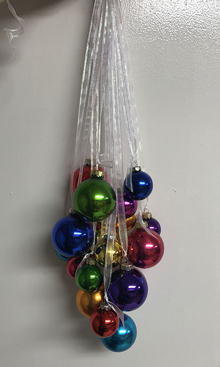 Small Ornaments Are Added To Hanging Arrangement