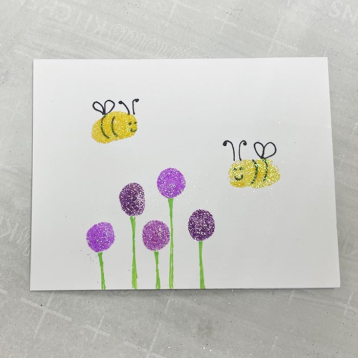 Adding additional bumblebee and flowers