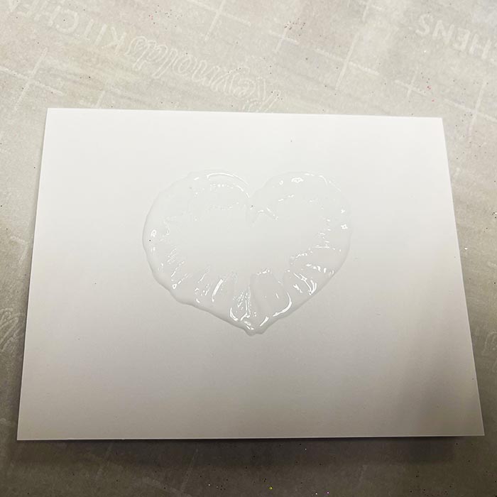 Drawing a heart with the glue bottle and smudging lines