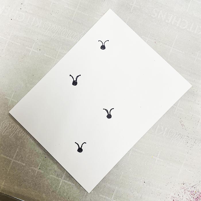 Drawing ladybug heads and antennas with pen