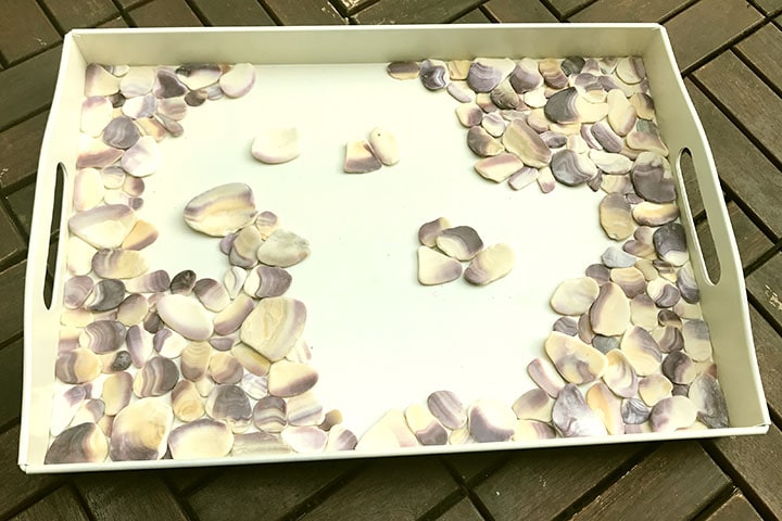 Gluing shells into corners of tray