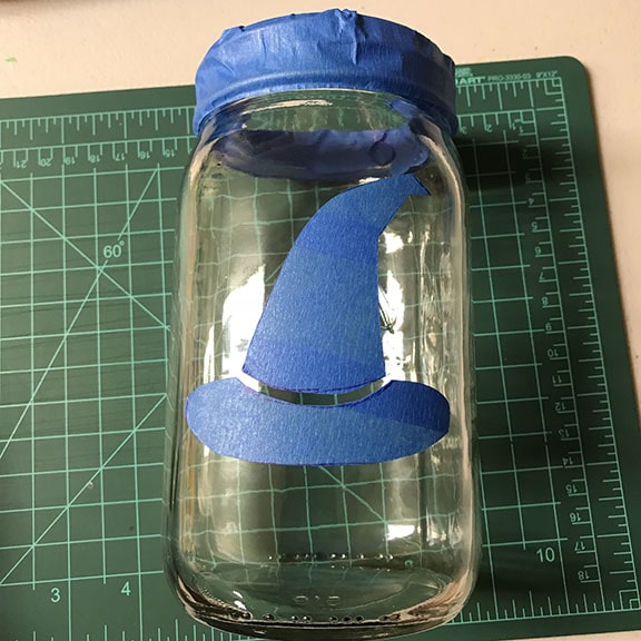 Painters tape shape stuck on mason jar