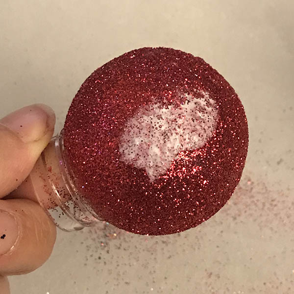 Covering ornament in glitter