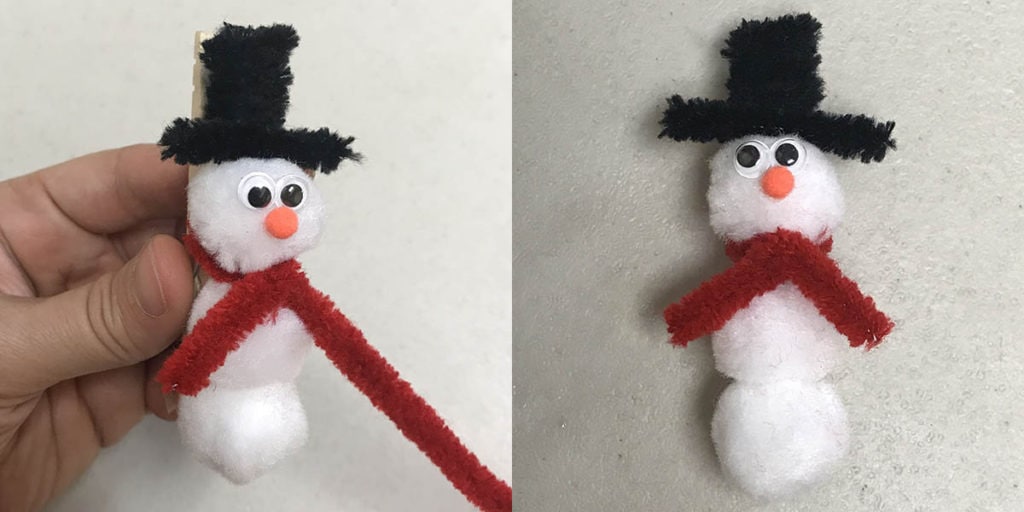Finishing pipe cleaner scarf on clothespin snowman