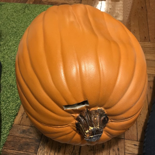 Craft Pumpkin Laid On Its Side So Stake Can Be Inserted