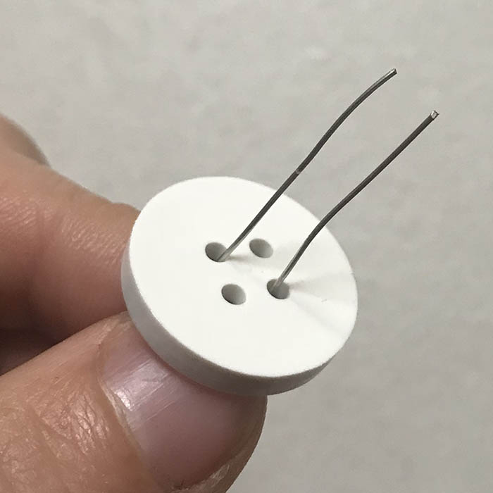 Threading Four Hole Button On Wire