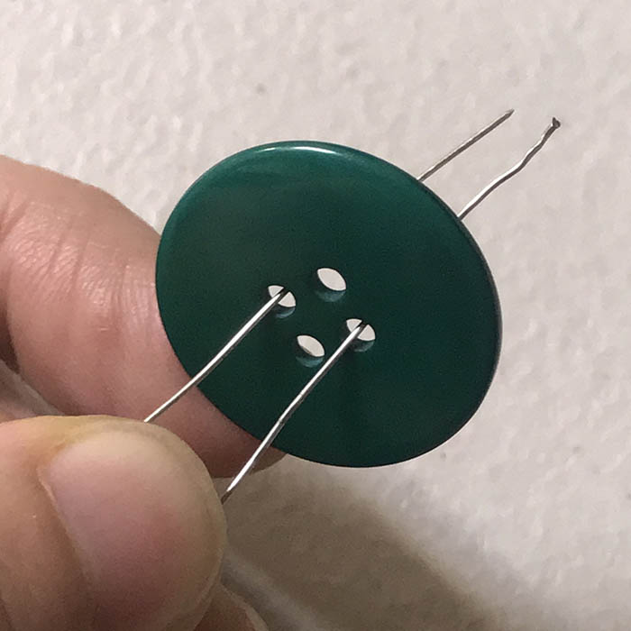 Threading 4 hole button on button Christmas ornament tree
