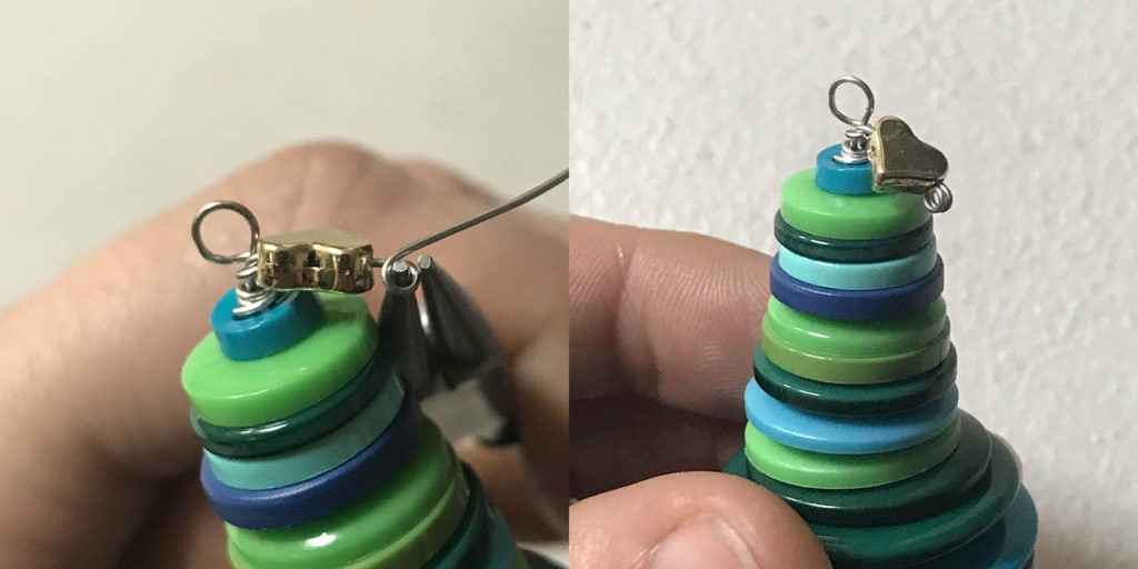 Attach decorative button to tree button Christmas ornament