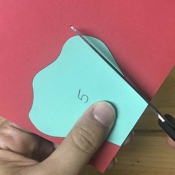 Cutting out paper flower petals using template