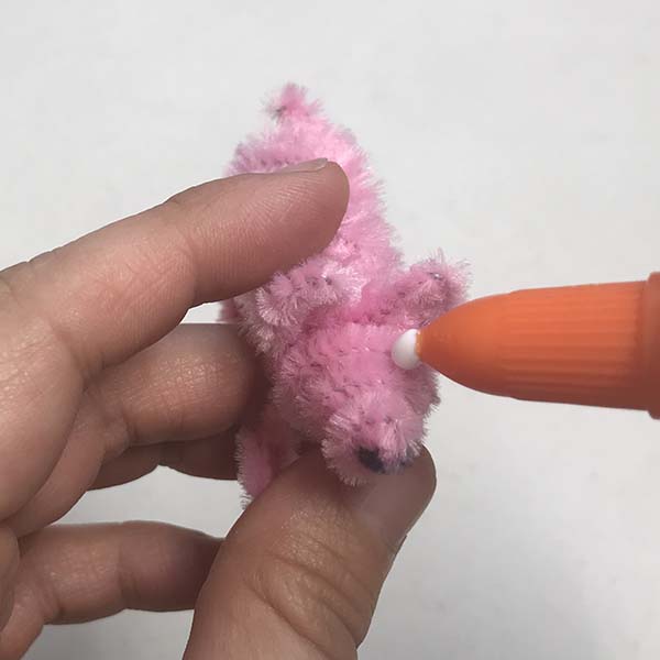 Adding googly eyes to pig