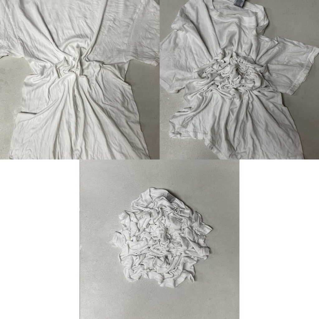 Gathering shirt together for crumple tie dye pattern