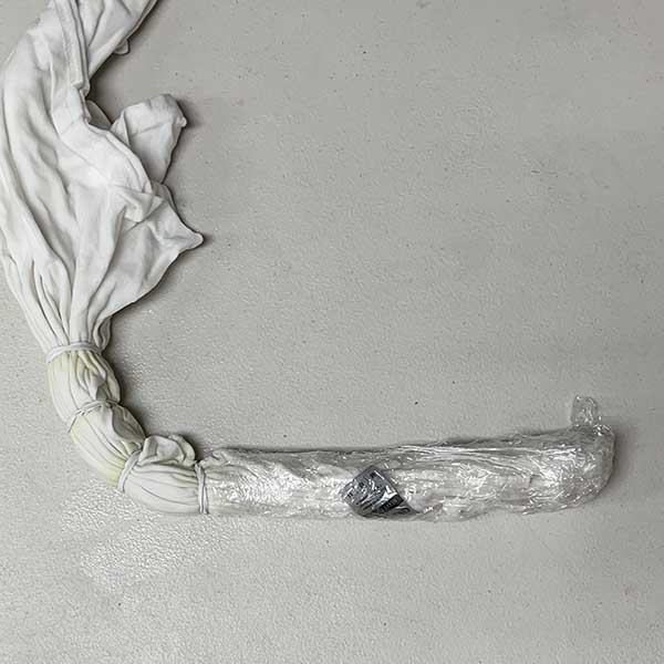 Wrapping white areas of shirt with plastic wrap to protect them