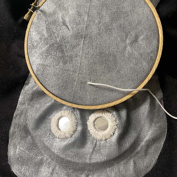 Moving embroidery hoop for mouth