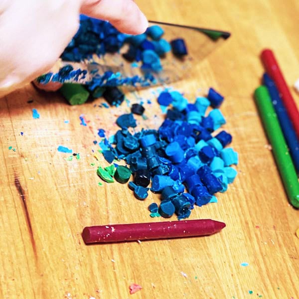 Cutting crayons into small pieces