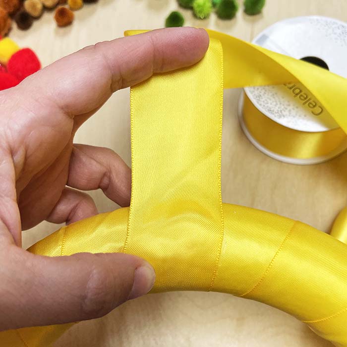 Securing the end of the ribbon