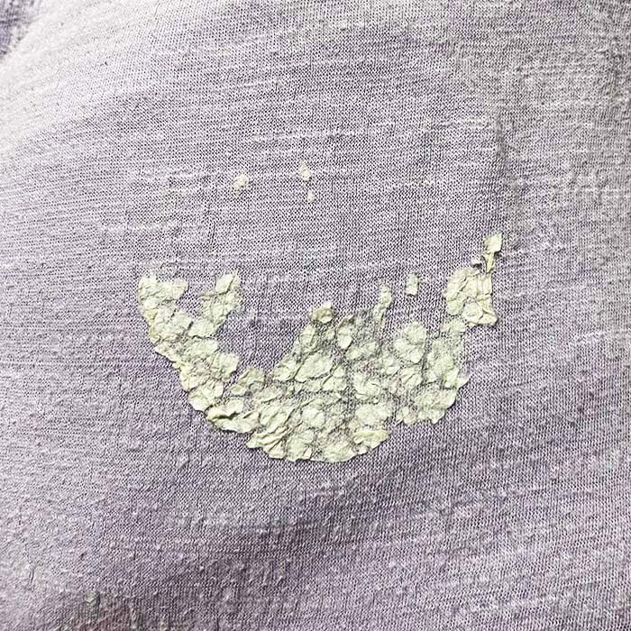 shirt with sticker residue on it