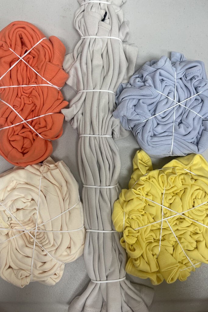 Colored shirts tied in tie dye patterns