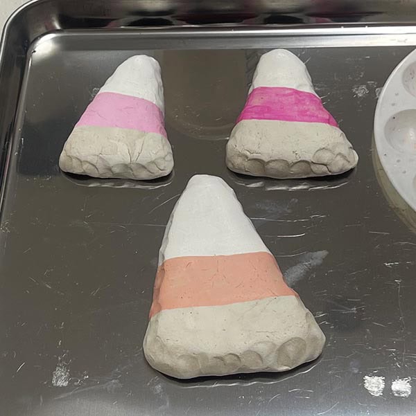 Painting backs of dishes with the second color