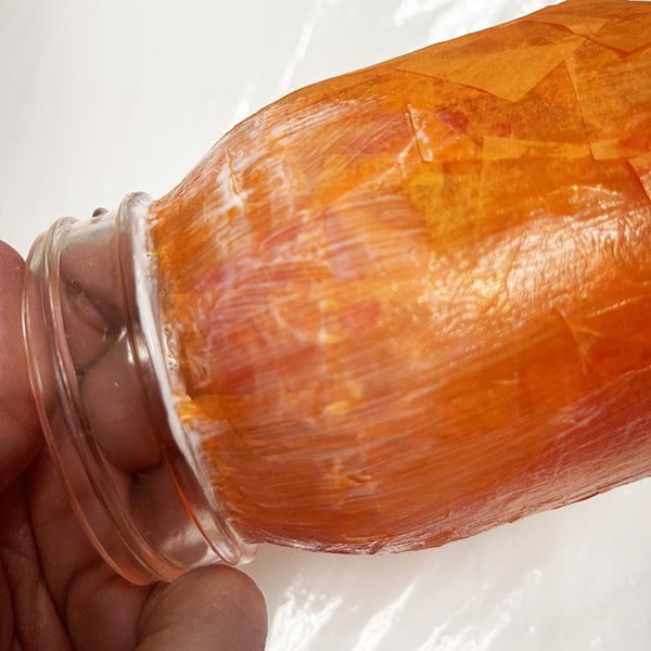 Making sure under the neck of the jar is sealed