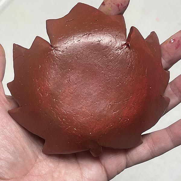 Painting darker second color on bottom of maple leaf bowl