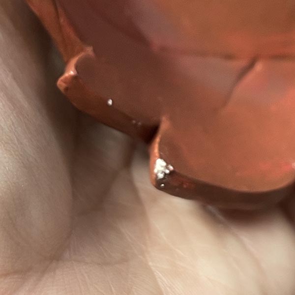 Chipped corner of leaf bowl