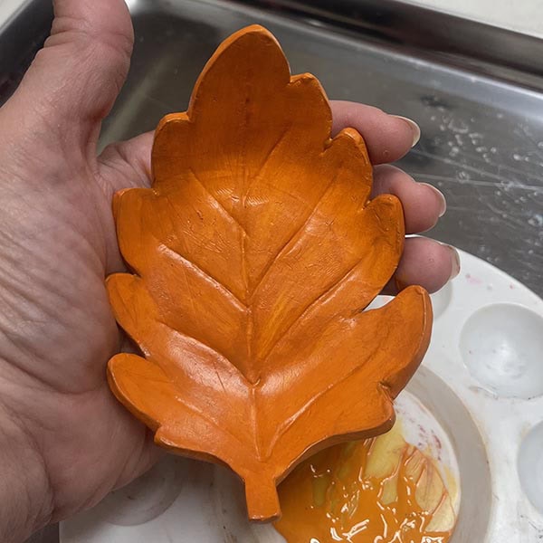 Painting darker second color on oak leaf bowl