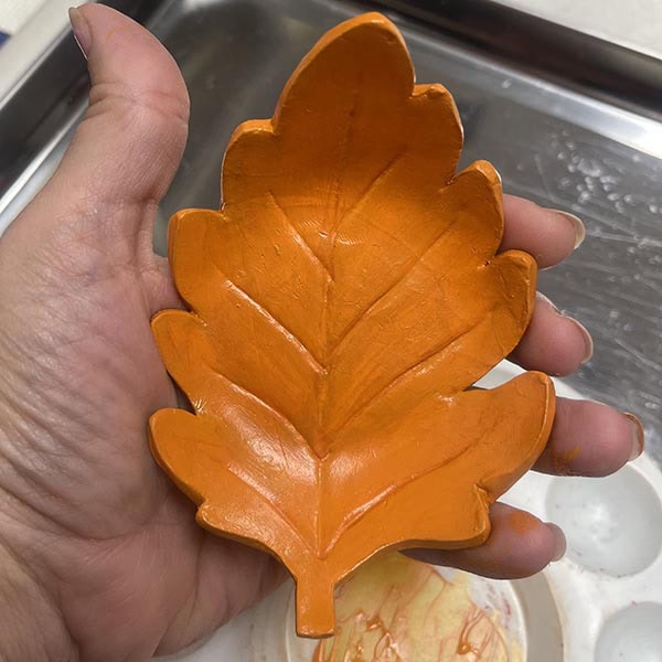 Painting final layer of first color on oak leaf