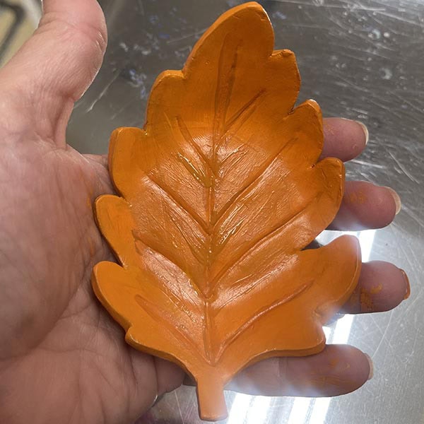 Painting details on veins of leaf